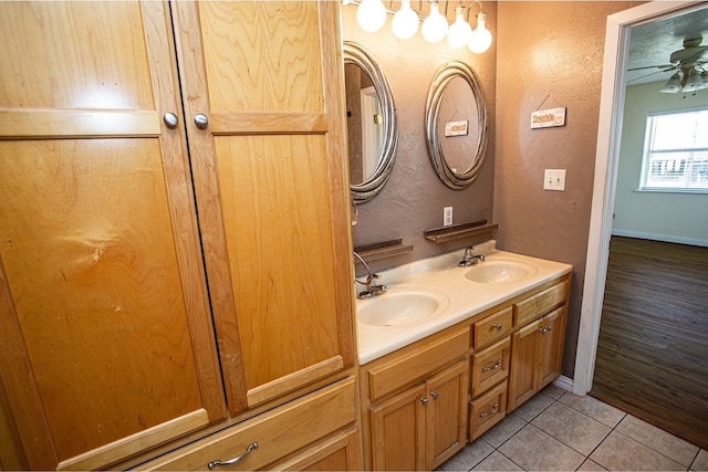 bathroom featuring tile patterned floors, ceiling fan, and vanity