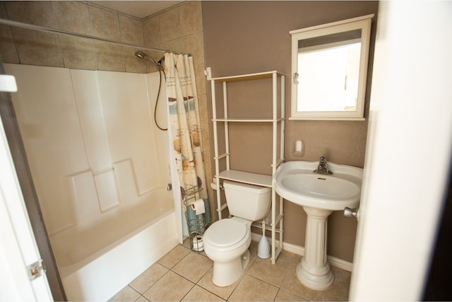 bathroom with shower / tub combo, toilet, and tile patterned floors