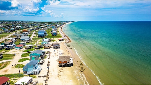 drone / aerial view with a water view and a view of the beach