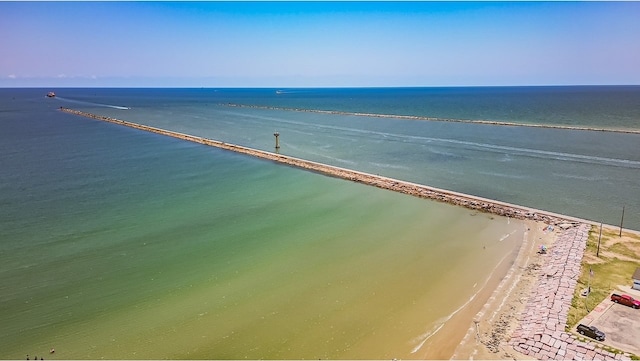 bird's eye view with a water view and a beach view