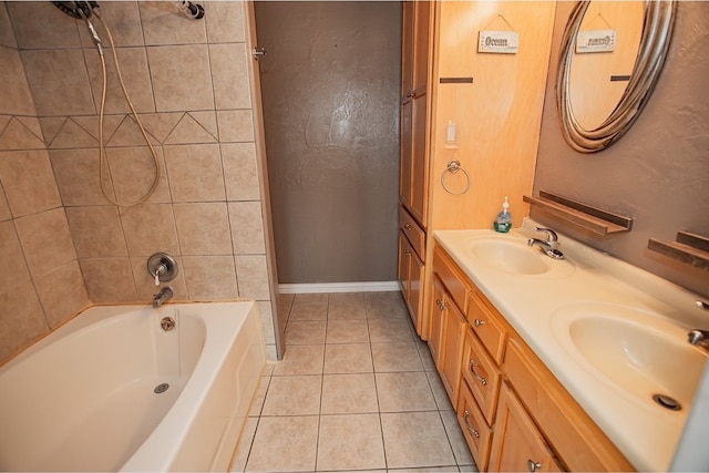 bathroom featuring vanity, tiled shower / bath combo, and tile patterned flooring