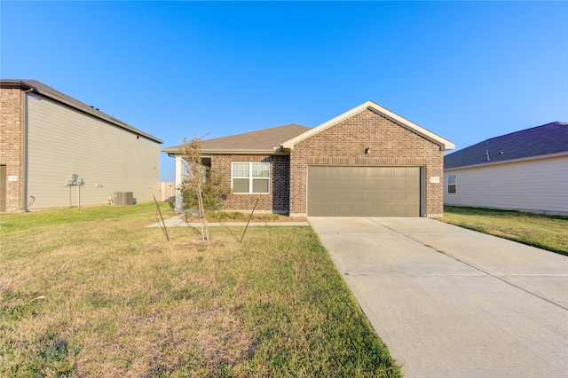 ranch-style home with a front lawn, central air condition unit, and a garage