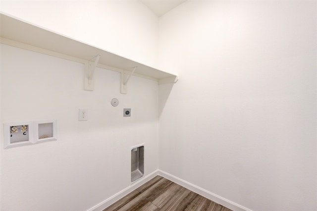 clothes washing area with hookup for a washing machine, hardwood / wood-style floors, and electric dryer hookup