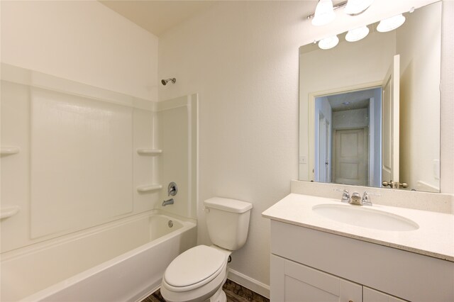 full bathroom with wood-type flooring, vanity, toilet, and washtub / shower combination