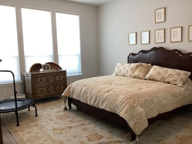 bedroom featuring multiple windows