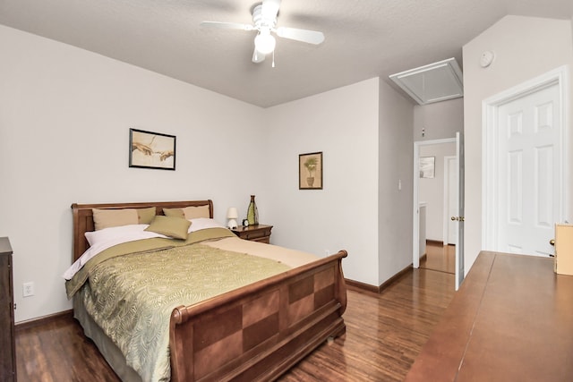 bedroom featuring ceiling fan, dark wood-type flooring, and a textured ceiling