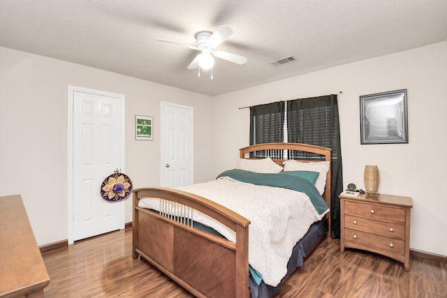 bedroom featuring ceiling fan and dark hardwood / wood-style flooring