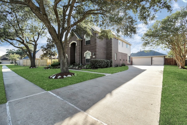 view of front of home with a garage and a front lawn