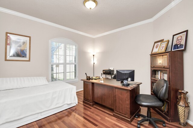 bedroom featuring crown molding and hardwood / wood-style floors