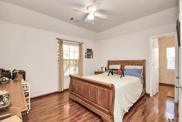 bedroom with dark wood-type flooring and ceiling fan