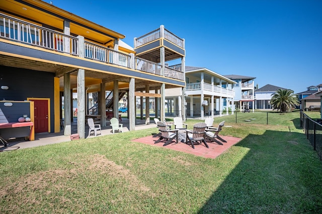 view of yard featuring a balcony and a patio area