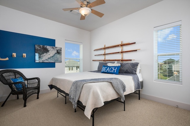 carpeted bedroom featuring ceiling fan