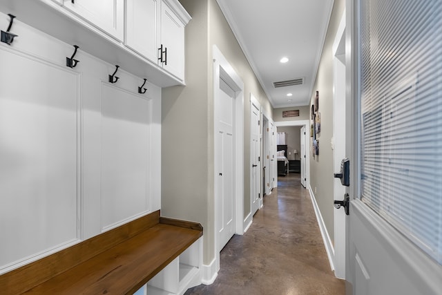 mudroom featuring crown molding