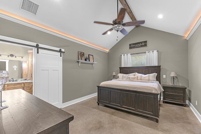 bedroom featuring beam ceiling, ceiling fan, a barn door, high vaulted ceiling, and ensuite bathroom