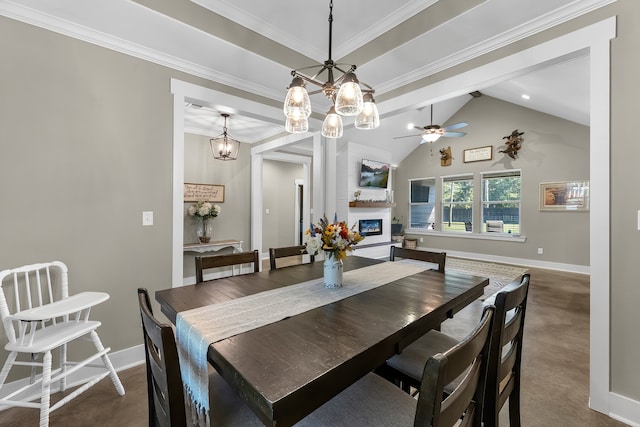 dining room featuring carpet, ceiling fan with notable chandelier, lofted ceiling, and ornamental molding