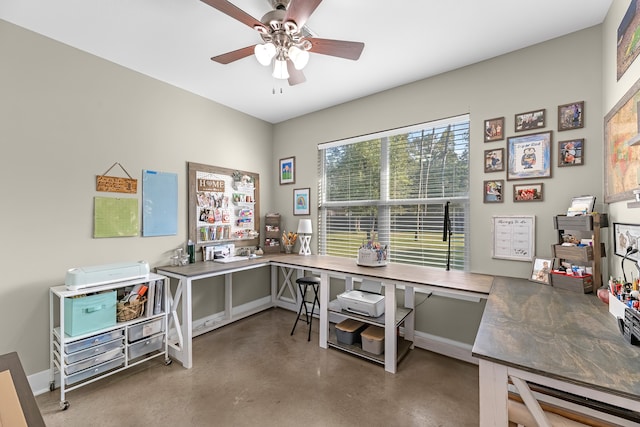 office area featuring concrete floors and ceiling fan