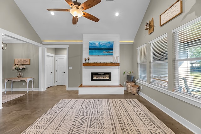 unfurnished living room featuring ceiling fan, concrete flooring, and vaulted ceiling