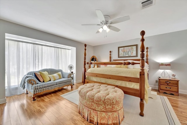 bedroom with ceiling fan and light hardwood / wood-style floors