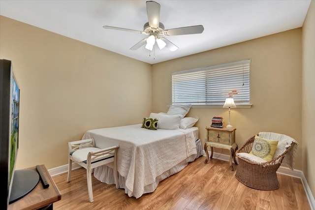 bedroom with light wood-type flooring and ceiling fan