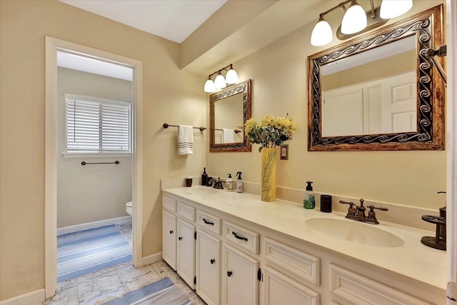 bathroom featuring wood-type flooring, vanity, and toilet