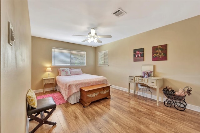 bedroom with ceiling fan and light hardwood / wood-style floors