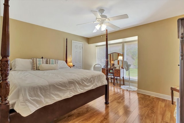 bedroom with ceiling fan and light hardwood / wood-style flooring