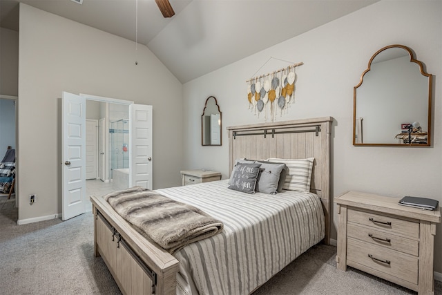 carpeted bedroom with ensuite bath, ceiling fan, and vaulted ceiling