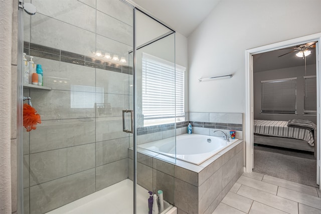 bathroom with ceiling fan, shower with separate bathtub, vaulted ceiling, and tile patterned floors