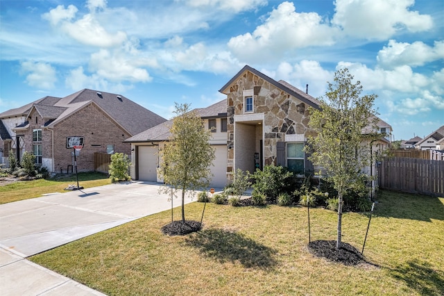 view of front of house with a front yard and a garage