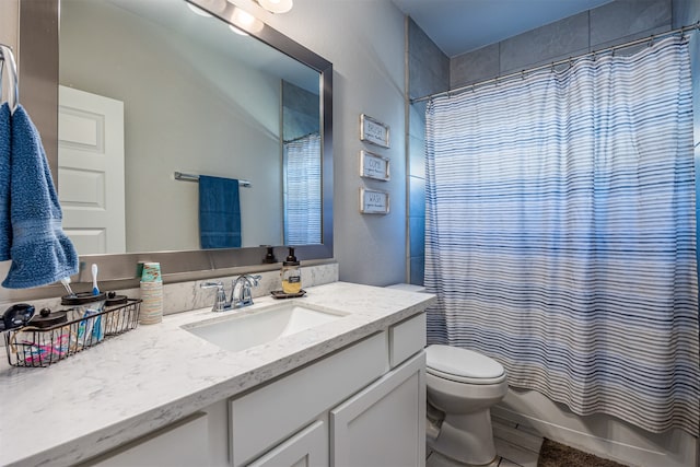 full bathroom featuring toilet, shower / tub combo, and vanity