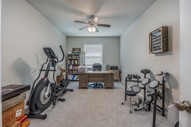 office with light carpet and ceiling fan