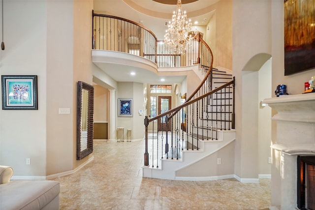 entryway featuring a high ceiling and a notable chandelier