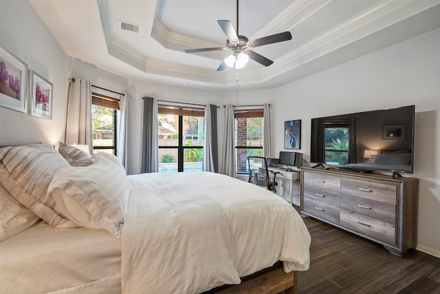 bedroom featuring a raised ceiling, ceiling fan, crown molding, and dark hardwood / wood-style floors