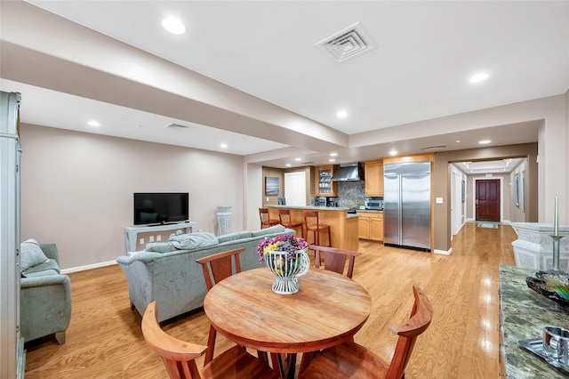 dining area with light hardwood / wood-style flooring