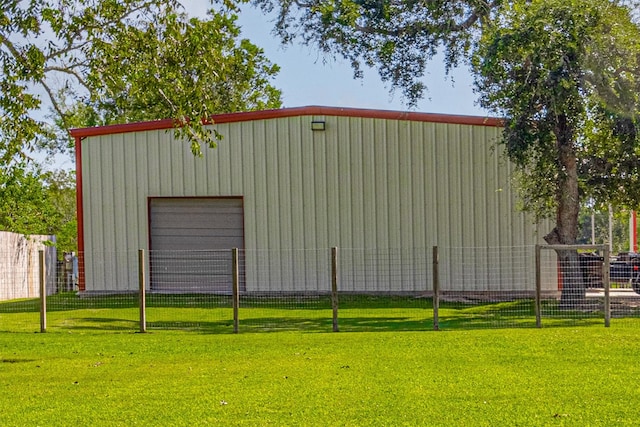 view of outbuilding featuring a lawn