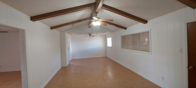 interior space featuring light tile patterned flooring, lofted ceiling with beams, and wood walls