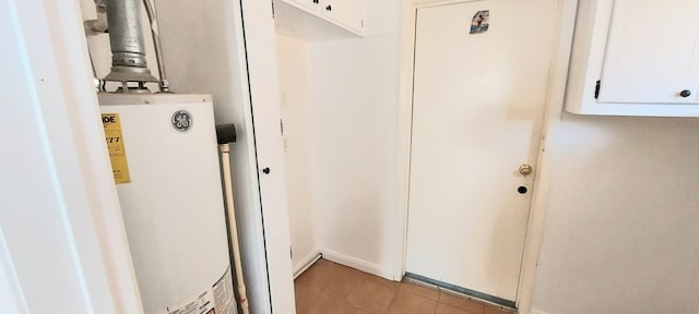 utility room with gas water heater