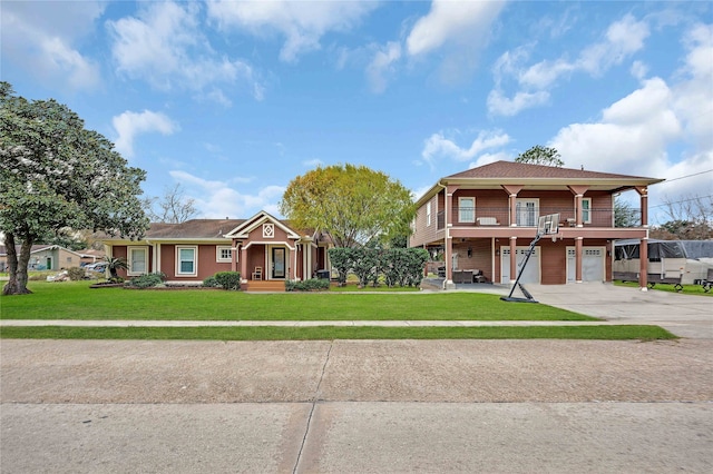 view of front of home with a front lawn and a garage