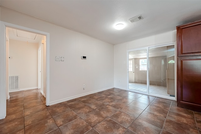 unfurnished bedroom featuring dark tile patterned floors, a closet, and a textured ceiling