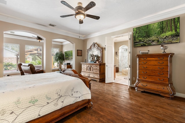 bedroom with dark hardwood / wood-style floors, ensuite bathroom, ornamental molding, and ceiling fan