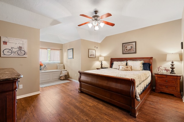 bedroom with lofted ceiling, ceiling fan, and dark hardwood / wood-style floors