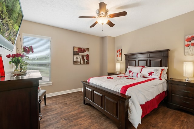 bedroom featuring dark hardwood / wood-style flooring and ceiling fan