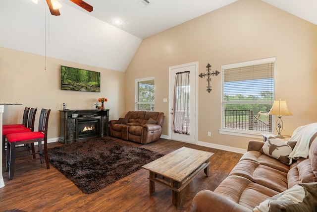 living room featuring ceiling fan, dark wood-type flooring, and high vaulted ceiling