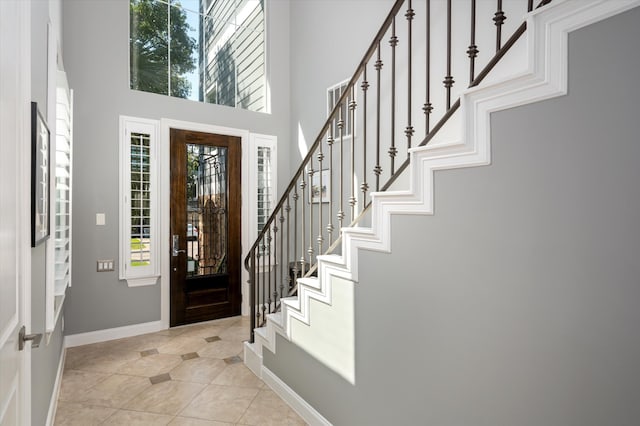 entrance foyer with light tile patterned flooring