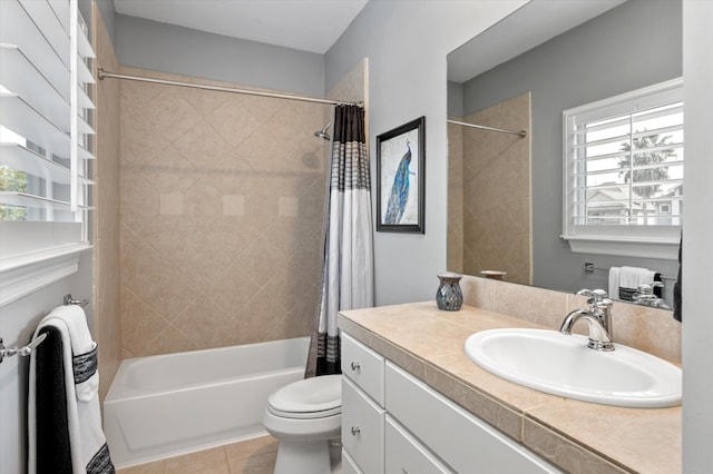 full bathroom with shower / tub combo, tile patterned floors, vanity, and toilet