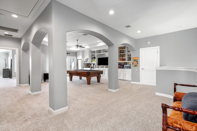 rec room featuring ceiling fan, pool table, built in shelves, and light colored carpet