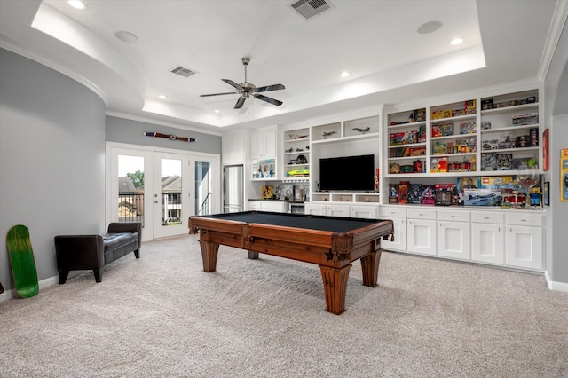 recreation room with a raised ceiling, light carpet, pool table, and ceiling fan