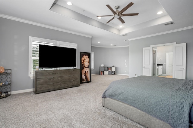 carpeted bedroom with crown molding, a tray ceiling, and ceiling fan