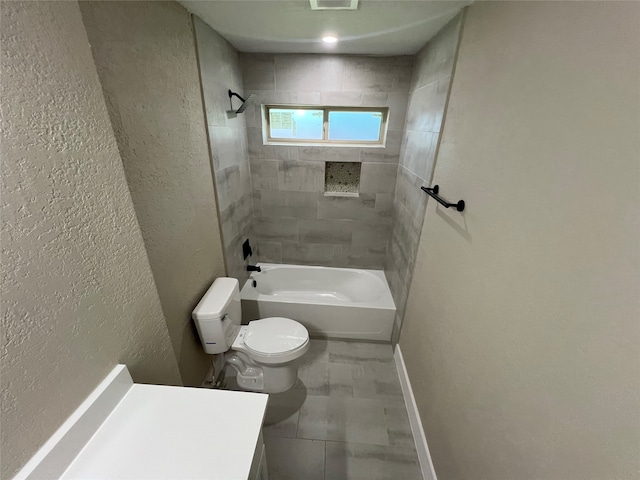 full bathroom with vanity, toilet, and tiled shower / bath combo