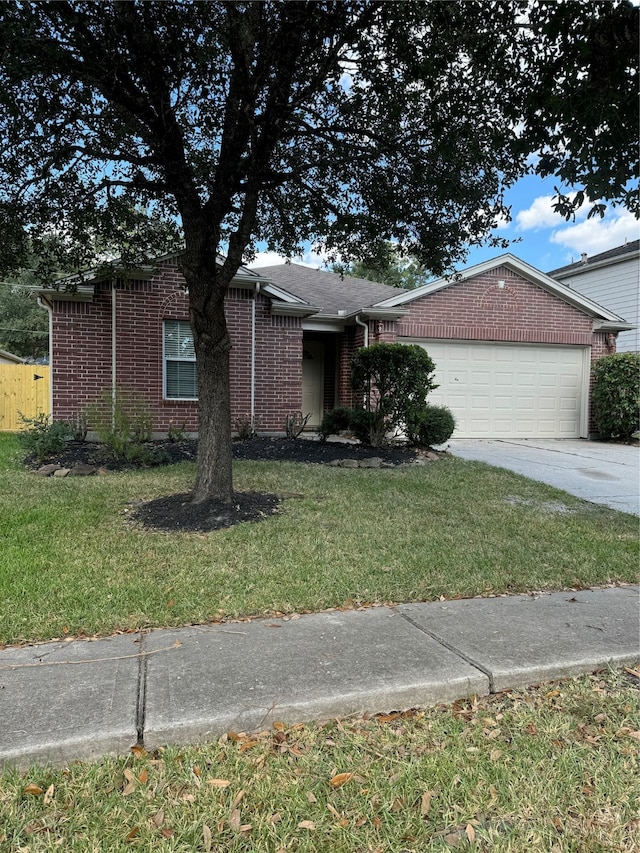 single story home with a front lawn and a garage